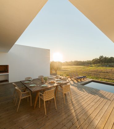 Dinner table setting in modern villa terrace